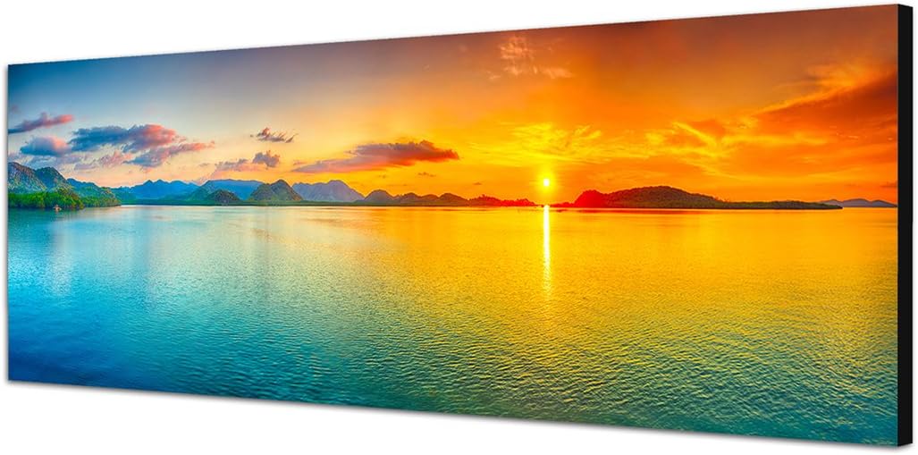 Paul Sinus Art Panoramabild auf Leinwand und Keilrahmen 150x50cm Meer Hügel Sonnenaufgang Wolkenschl