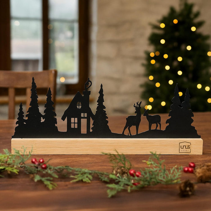 UNUS Aufsteller Haus im Wald mit Rehen Winterdeko aus Metall mit Bambusfuss 30x13 cm Schwarz oder We