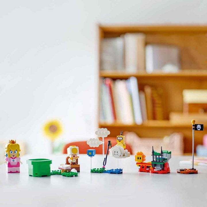 LEGO Super Mario Abenteuer mit der interaktiven Peach, Spielset für Kinder mit gelbem Toad, Nintendo