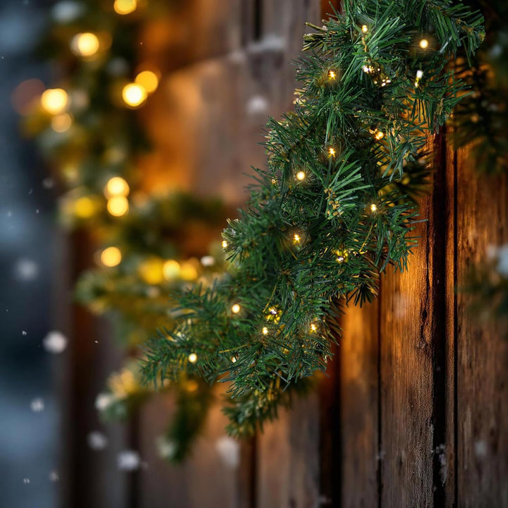 Spetebo Weihnachtsgirlande grün mit 70 LED Lichterkette warmweiss für Aussen - 540 cm - Kunst Tannen