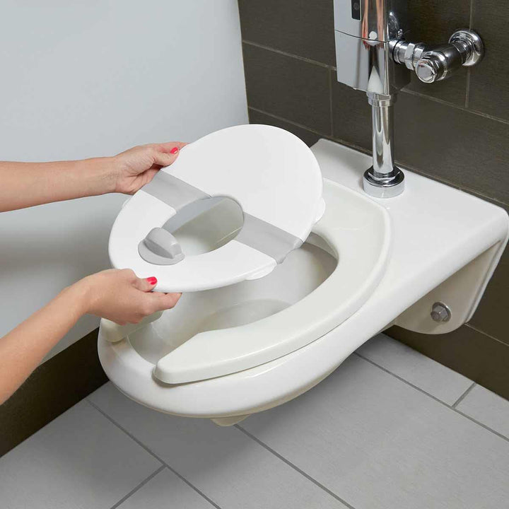 Fisher-Price HBM74 - 2-in-1 Reisetöpfchen und Toilettensitz  – tragbares Trainingstöpfchen mit abneh