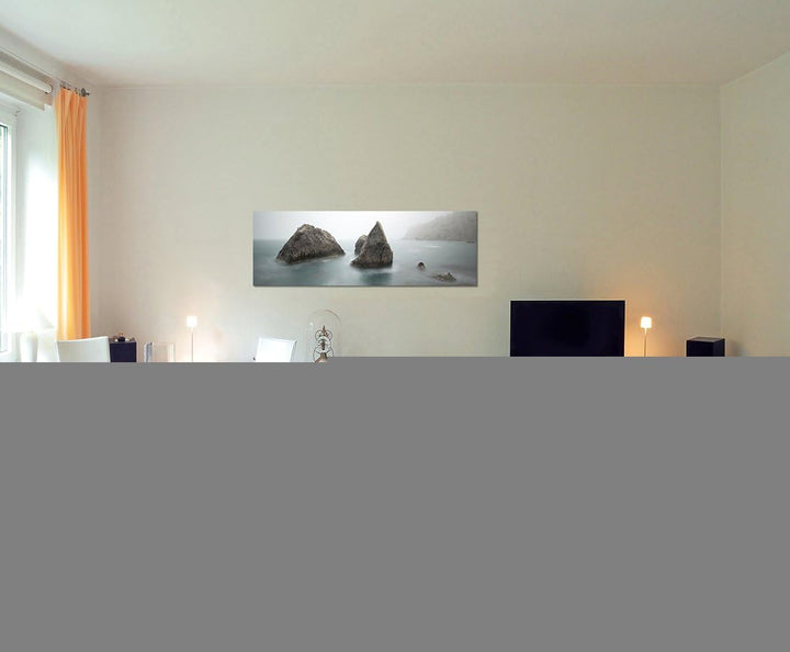 Paul Sinus Art Panoramabild auf Leinwand und Keilrahmen 150x50cm Meer Morgendämmerung Nebel Felsen