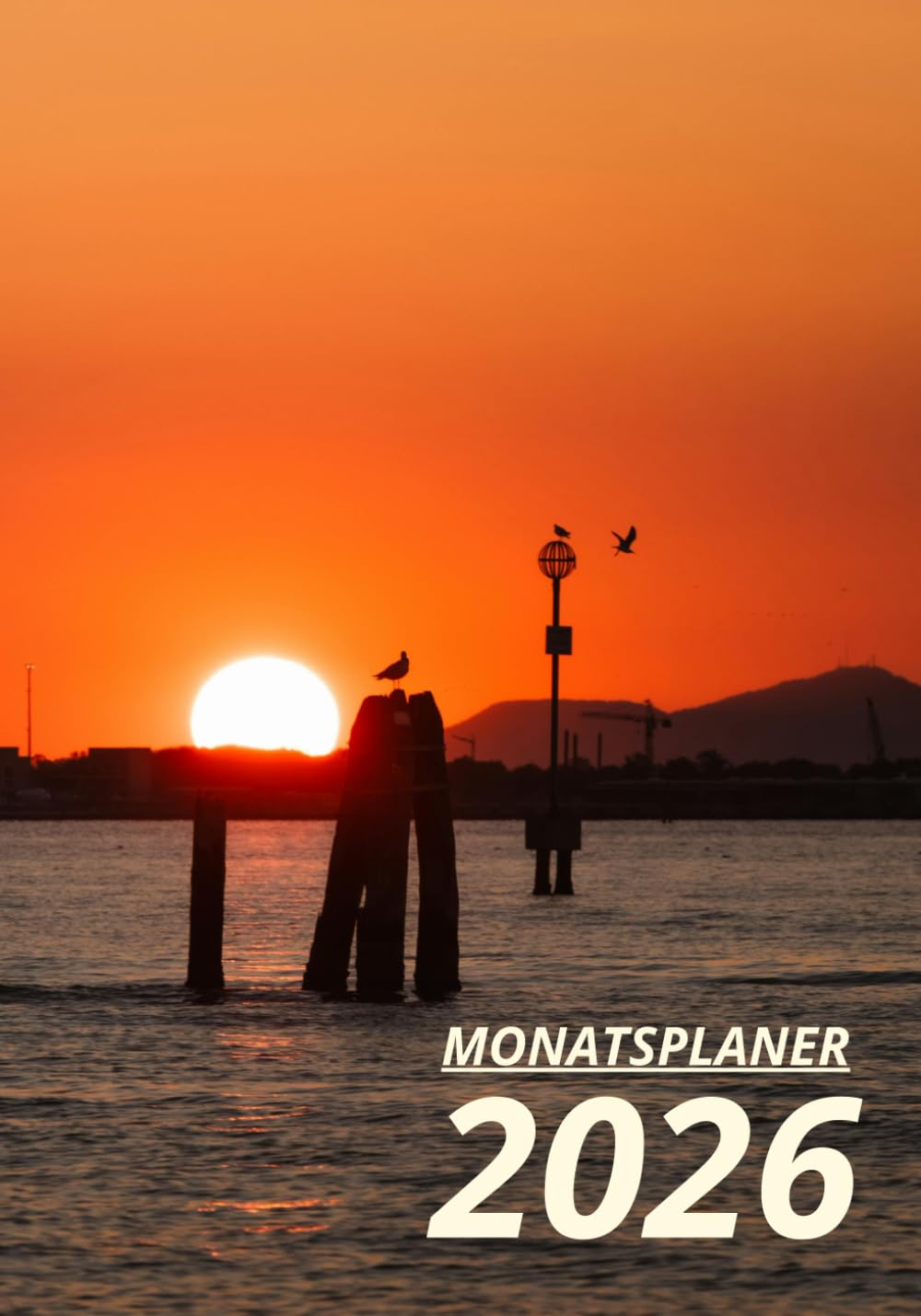 Monatsplaner 2026: Ein Teambuilding-Organisator und Business-Motivator mit einem Cover im Sonnenunte