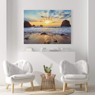 PICANOVA – Bild auf Leinwand Felsiger Strand Sonnenuntergang 100x75cm – Leinwandbild – Premium Leinw