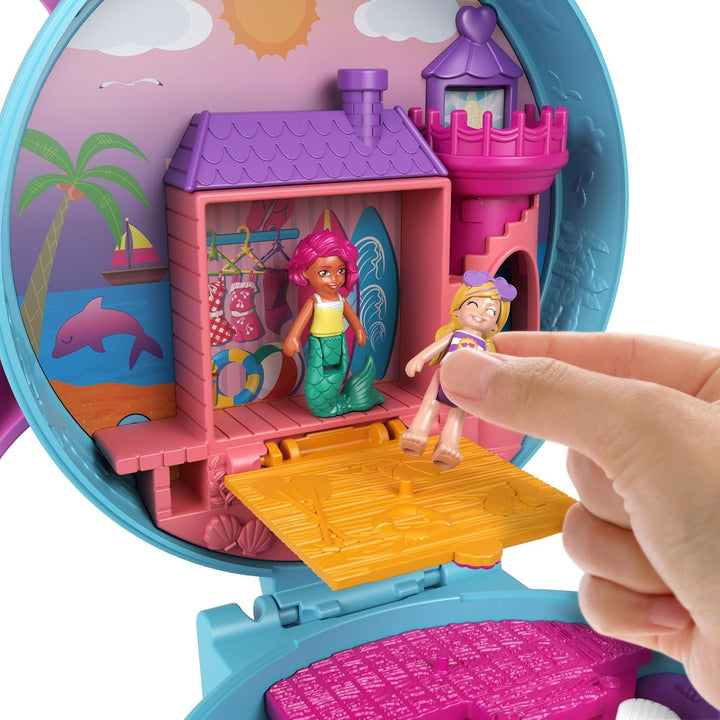 Polly Pocket GTN20 - Delfinstrand Schatulle, 2 kleine Puppen, 5 Überraschungen, 13 Zubehörteile, Pop