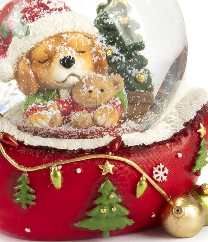 Schneekugel mit Welpe Hund, festliche Dekoration aus Harz, roter Sockel mit Weihnachtsbäumen und Sch