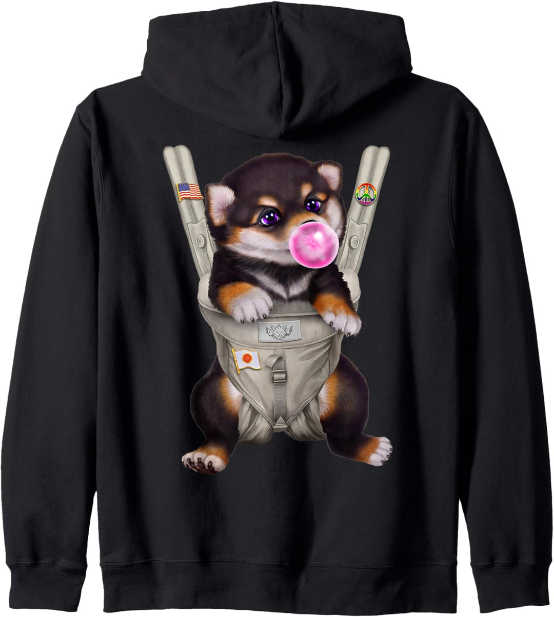 Schwarzer Shiba Hund mit Kaugummi in der Babytrage Kapuzenjacke