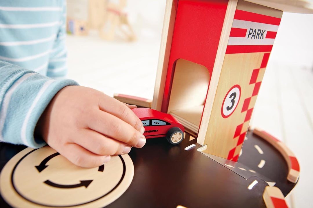 Parkhaus Spielset aus Holz von Hape | Autogarage auf drei Ebenen mit Autos und Hubschrauber