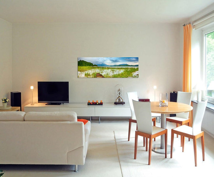 Paul Sinus Art Panoramabild auf Leinwand und Keilrahmen 150x50cm See Gras Boot Berge Landschaft Dämm