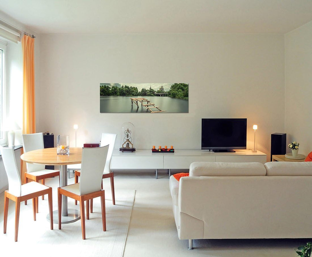 Paul Sinus Art Panoramabild auf Leinwand und Keilrahmen 150x50cm See Holzsteg Bäume Kirche Himmel