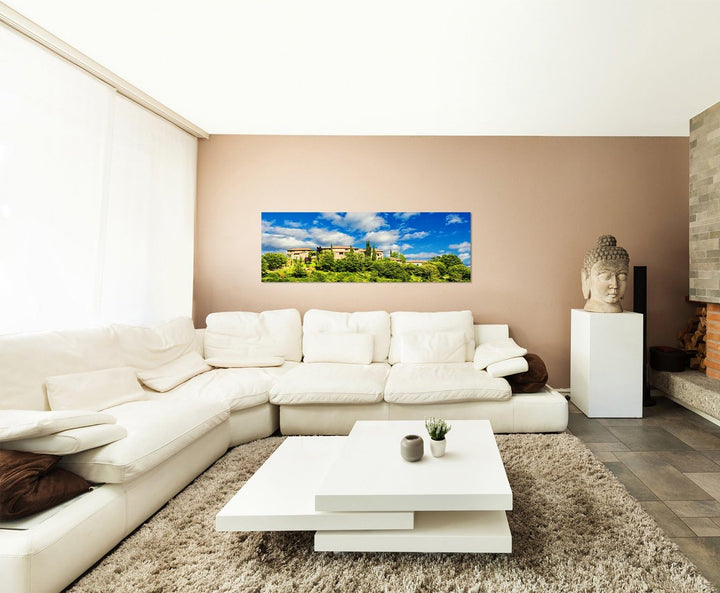 Paul Sinus Art Panoramabild auf Leinwand und Keilrahmen 150x50cm Toskana Dorf Bäume Wolken Sommer