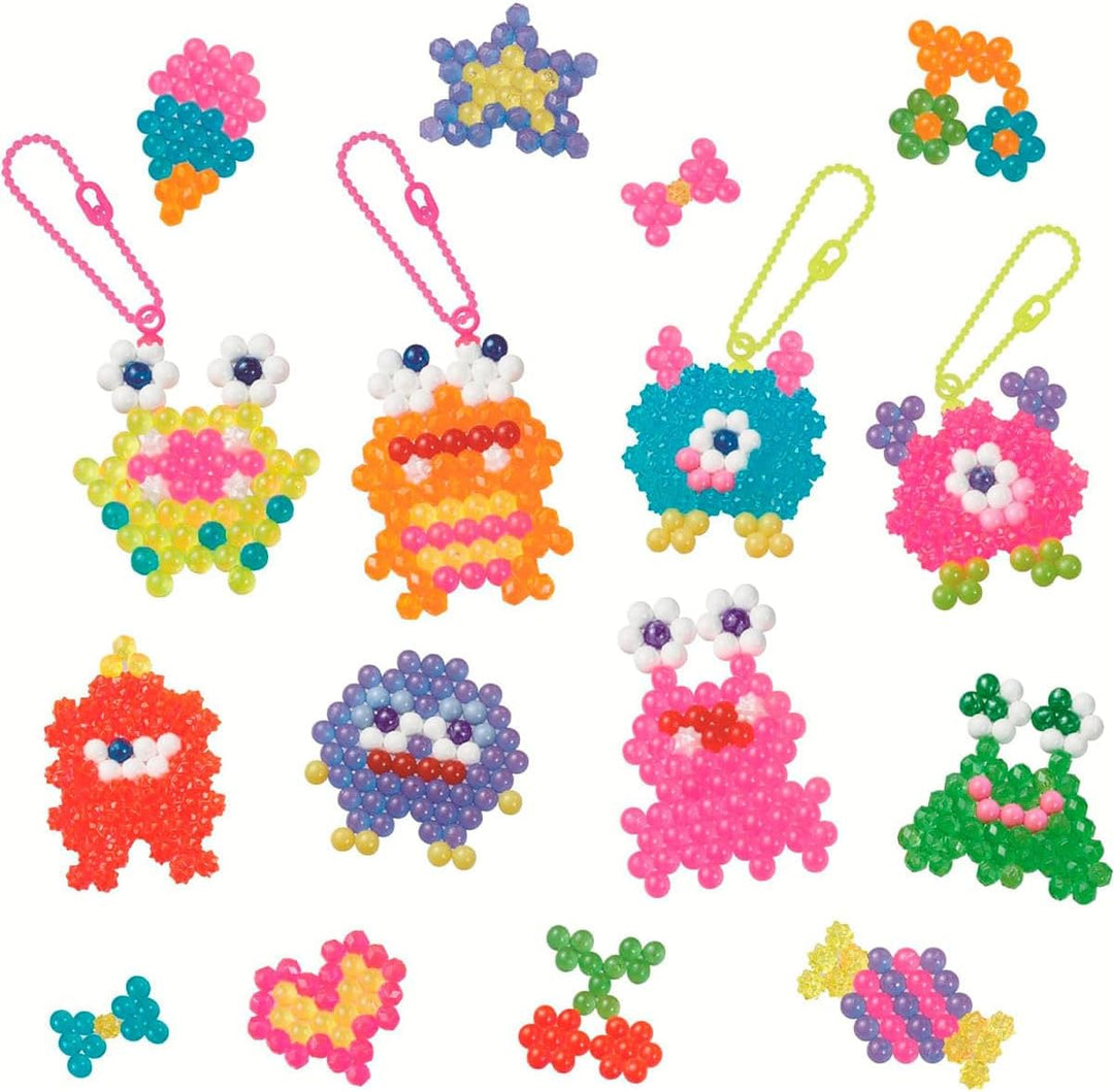 Aquabeads - 35144 Verrückte Monster Bastelset, Wasserperlen Bastelset für Kinder ab 4 Jahren, Bastel