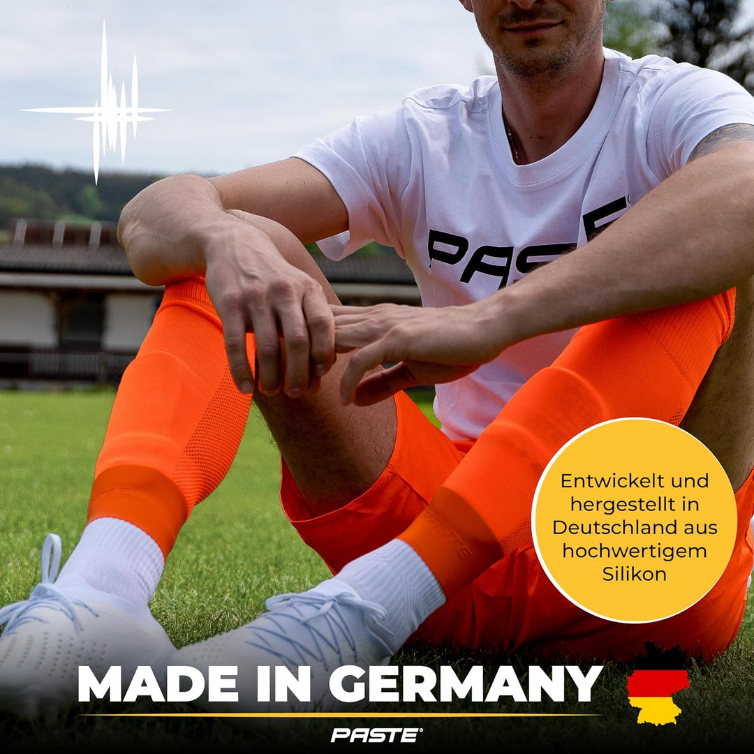 PASTE ® Schienbeinschonerhalter aus Silikon - DAS ORIGINAL - Fussball für Herren, Damen & Kinder Ora