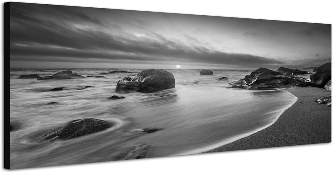Paul Sinus Art Leinwandfoto als Panorama SCHWARZ/Weiss 150x50cm Meer Strand Steine Sonnenaufgang Wol