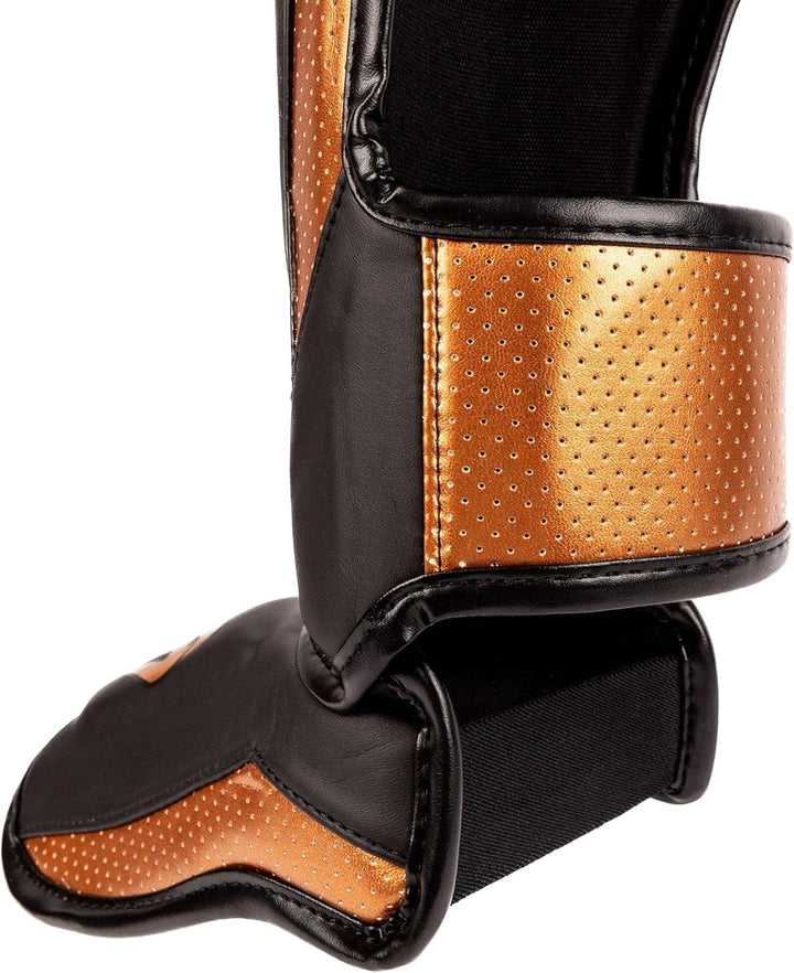 Venum Elite Evo Schienbeinschoner L Schwarz / Bronze, L Schwarz / Bronze