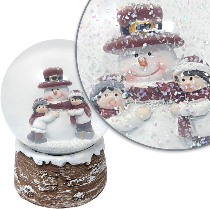 com-four® Weihnachtsschneekugel – Festliche Dekoration mit ansprechendem, glitzerndem Schneefall Fei