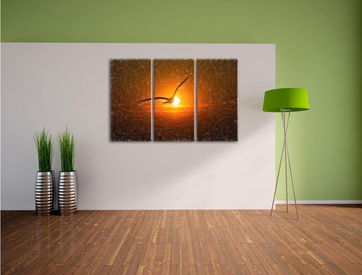 Pixxprint Möwe fliegt in den Sonnenuntergang als Leinwandbild/Grösse: 3 Teilig (120x80) cm/Wandbild/