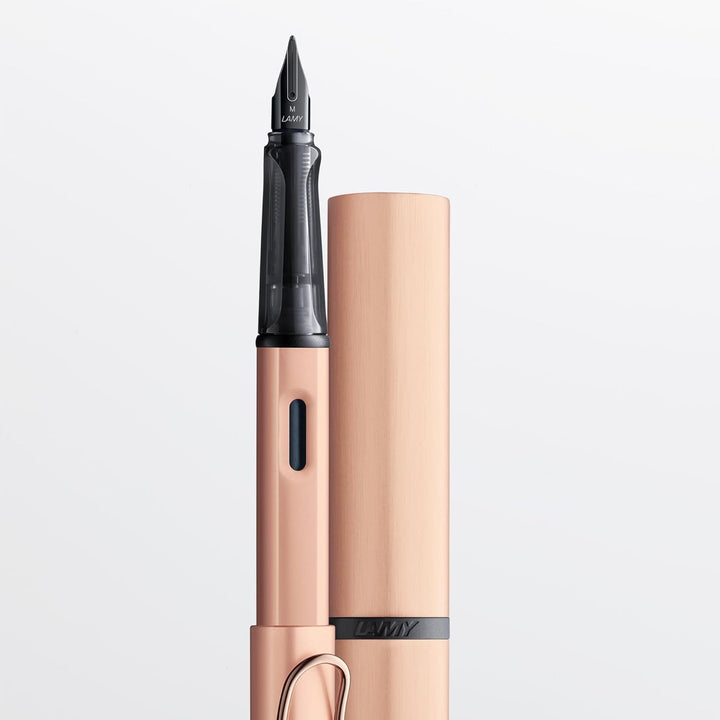 LAMY Lx Füllhalter 076 – Füller aus Aluminium in der Farbe Roségold mit transparentem Griffstück und