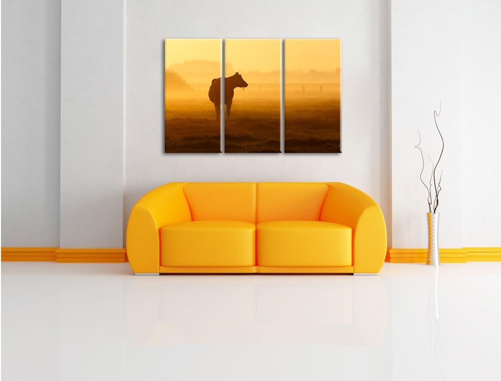 Pixxprint eine fressende Kuh auf der Weide als Leinwandbild - Grösse: 3-Teilig (120x80cm) - Wandbild