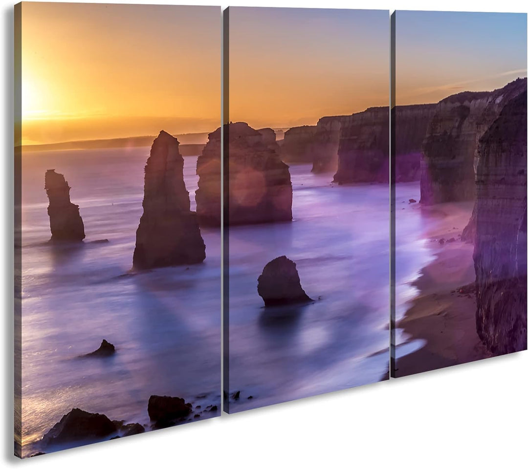 deyoli Atemberaubender Sandstrand im Sonnenuntergang Format: 3-teilig 120x80 als Leinwand, Motiv fer