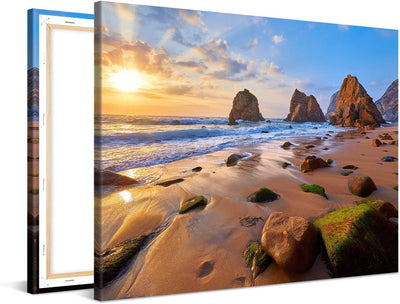 PICANOVA – Bild auf Leinwand Meeresstrand mit Felsen 100x75cm – Leinwandbild – Premium Leinwanddruck